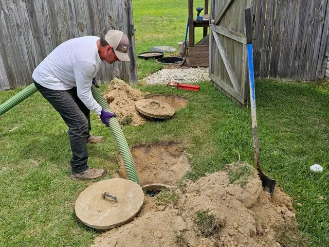 Licensed professional performing septic inspection on Long Island