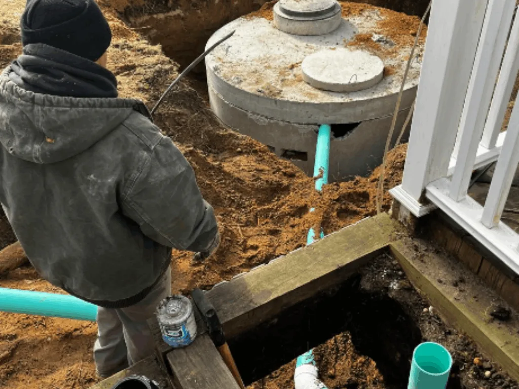 SewerTech LI heavy equipment excavating ground for a new septic system installation in Suffolk County NY.