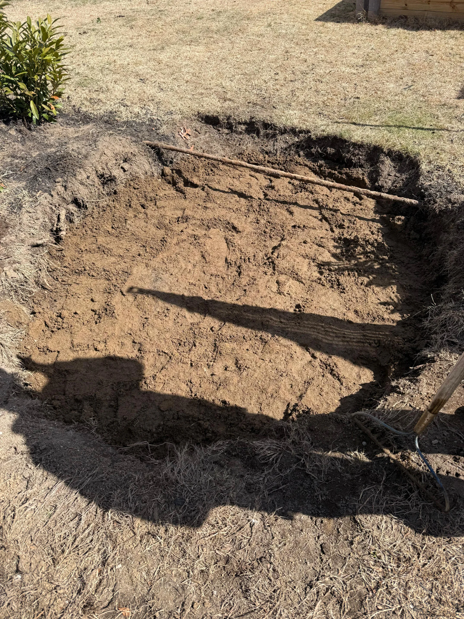 SewerTech technician providing professional septic tank locating services using an electronic locator probe in Suffolk County, NY.locator probe to find a buried septic tank system in Suffolk County NY.